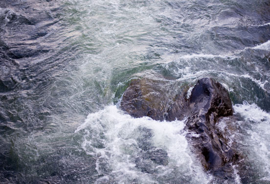Waves hitting a rock